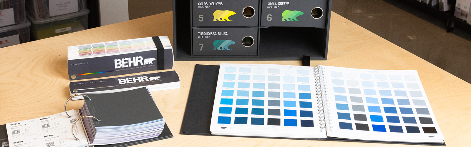 An image of a large empty classroom hallway with a green, gray and white color combination.