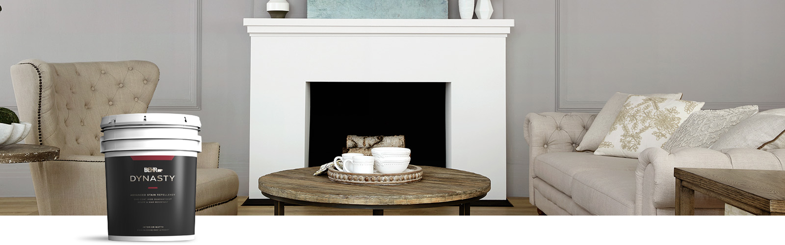 gray living room image with Behr Dynasty Interior paint can in the foreground