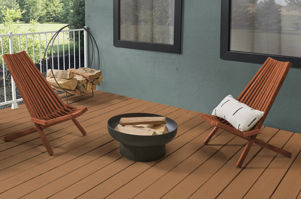 Deck with two chairs around a fire pit.