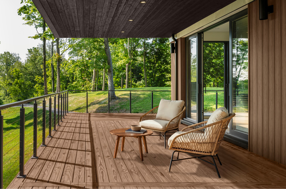 Deck with two chairs around a fire pit.