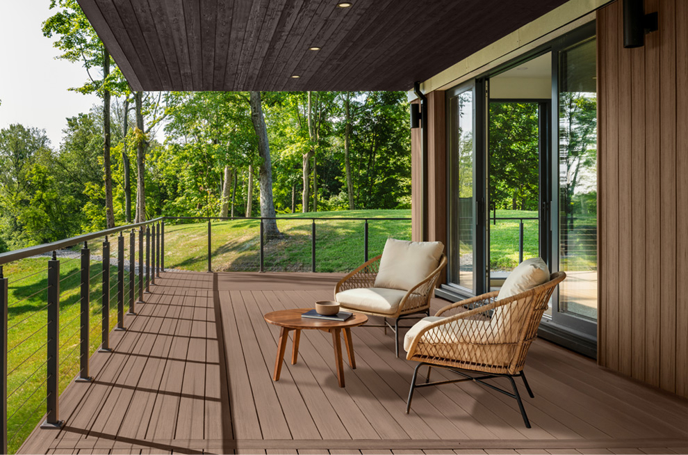 Deck with two chairs around a fire pit.