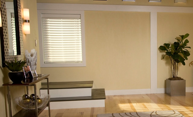 Window above steps on yellow colored walls