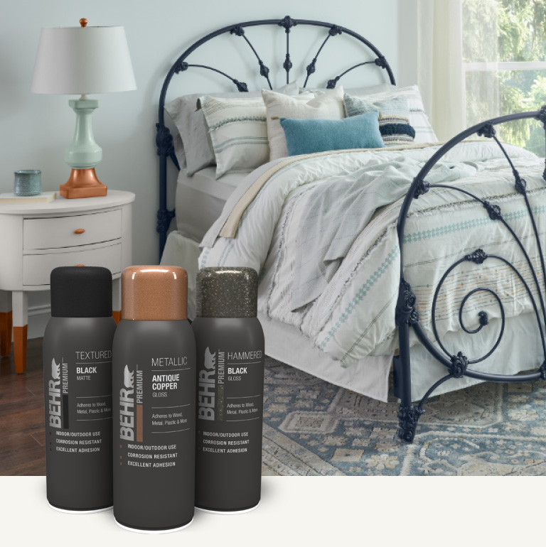 Mobile image of a bedroom with spray painted bed frame, lamp, and night stand